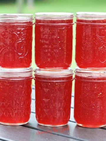 strawberry jam jars stacked.